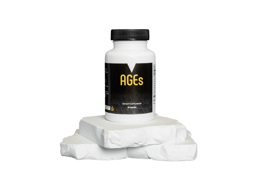 A bottle of pills sitting on top of some white rocks.