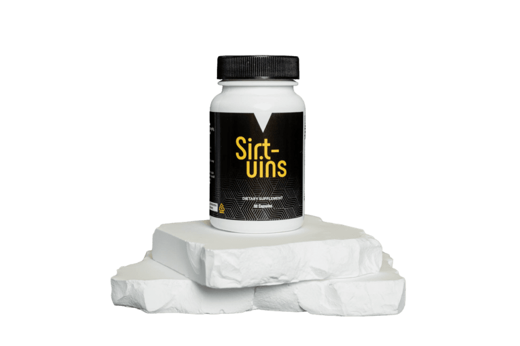 A bottle of sift-uins on top of some white rocks.