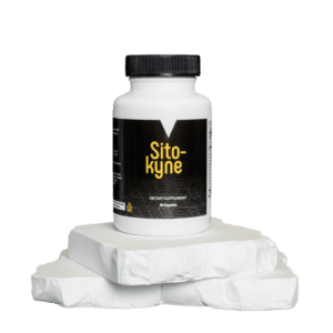 A bottle of white paint sitting on top of some paper.
