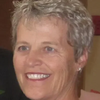 Smiling woman with short gray hair